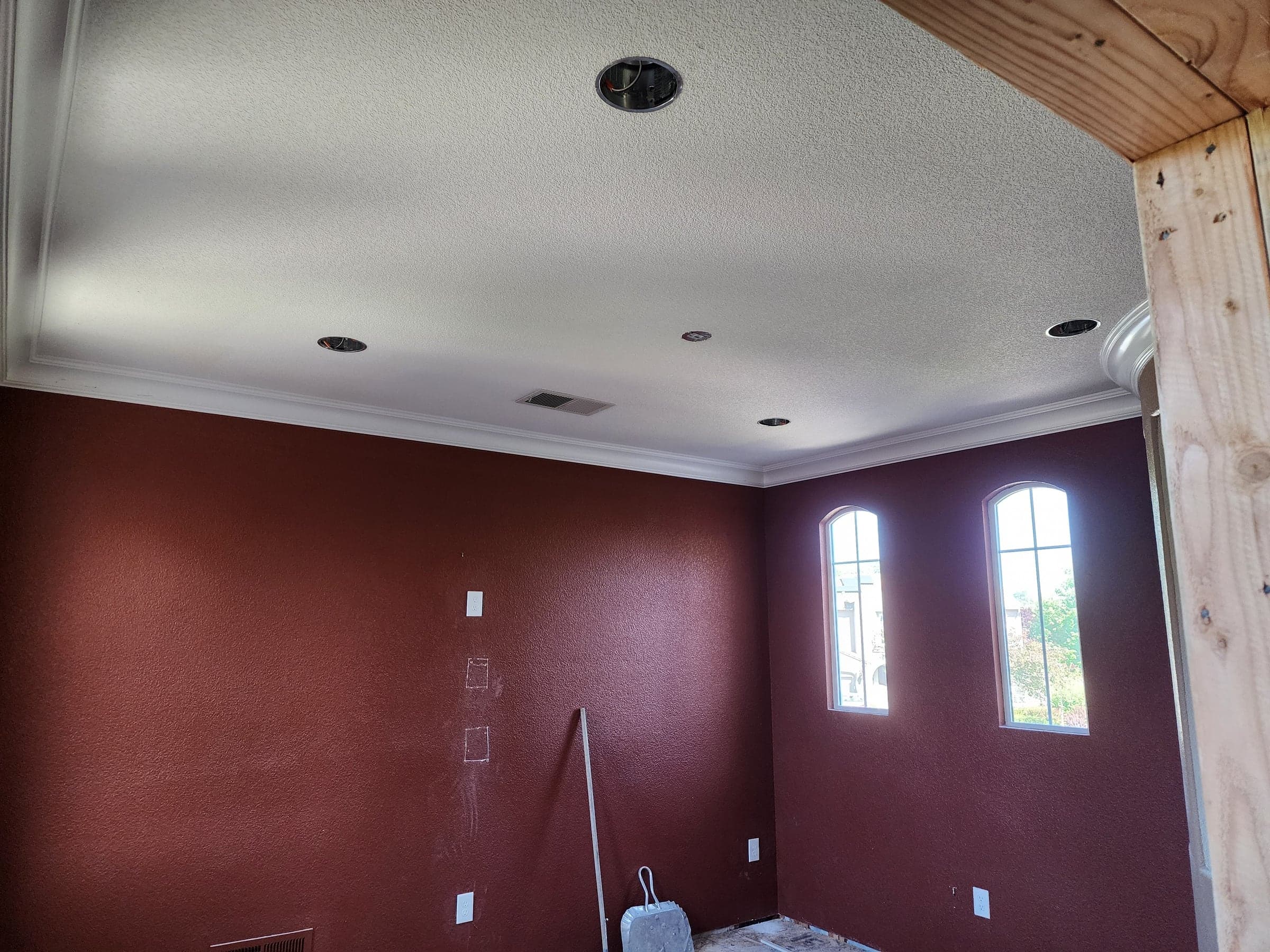 Recessed lighting installed in a room with arched windows and crown molding in Carmichael, CA